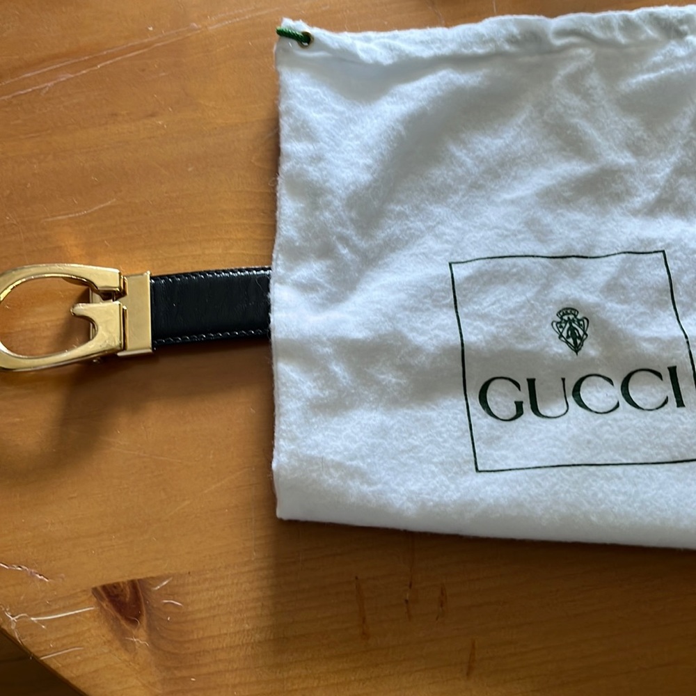 Gucci belt that reverses from black to brown when turning the buckle.